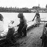 Woman and men pulling ferry in Petsamo 1930-35.JPG